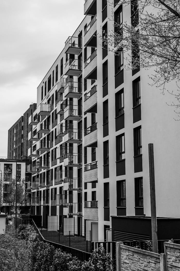 Contemporary apartment buildings captured in black and white, showcasing urban architecture.